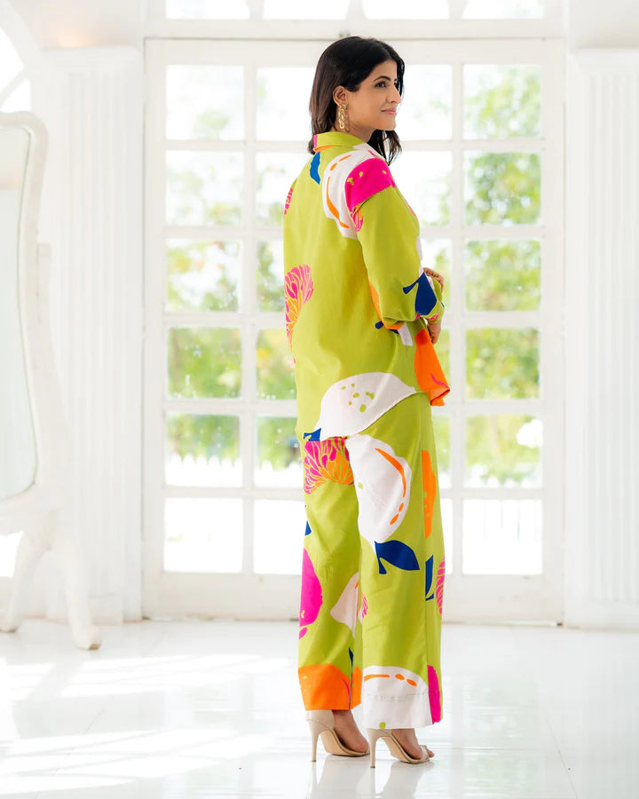 Printed co-ord set in lime green with long-sleeve top and straight-leg pants, side view