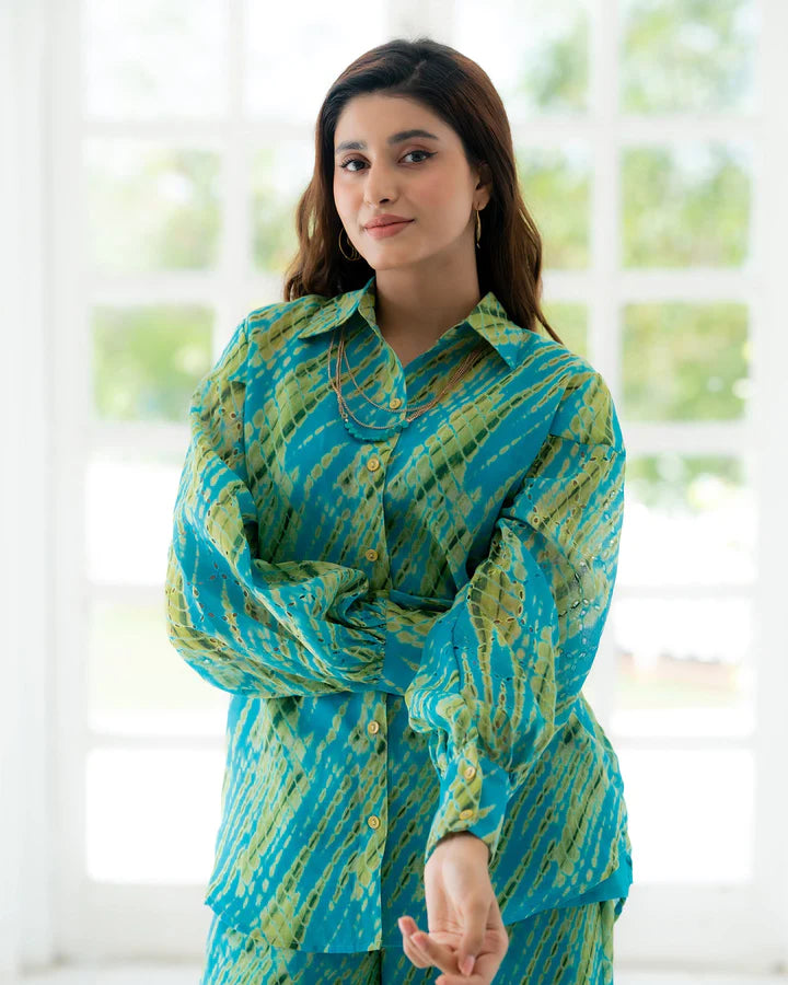 Turquoise patterned co-ord set with long-sleeve button shirt and matching trousers