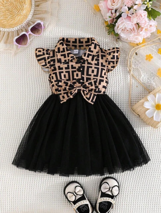 Girls black tulle party dress with geometric bodice bow and short sleeves