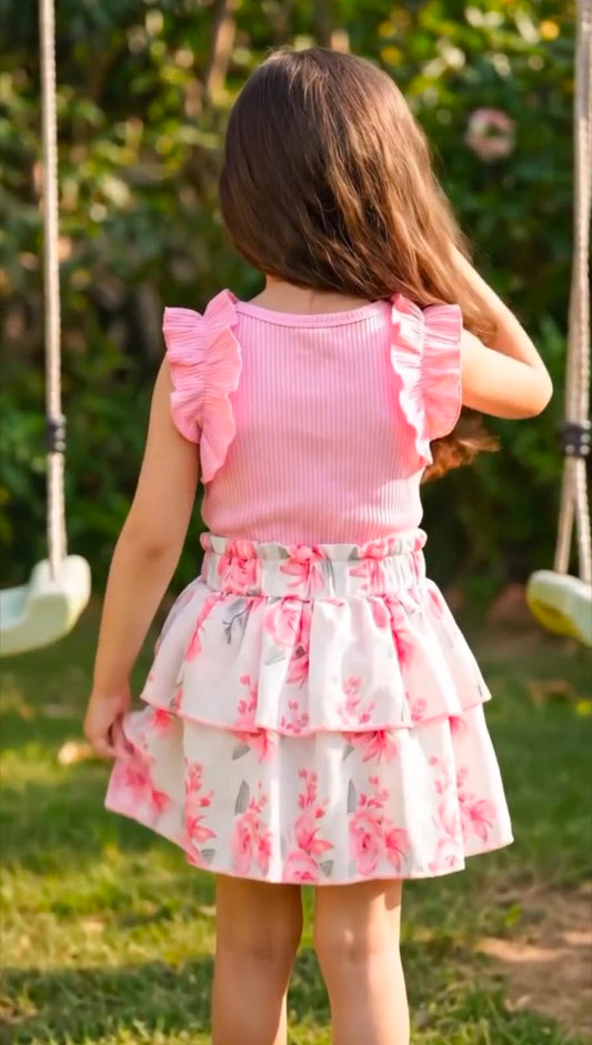 Girls' pink ruffle sleeve top and layered floral skirt outfit, back view
