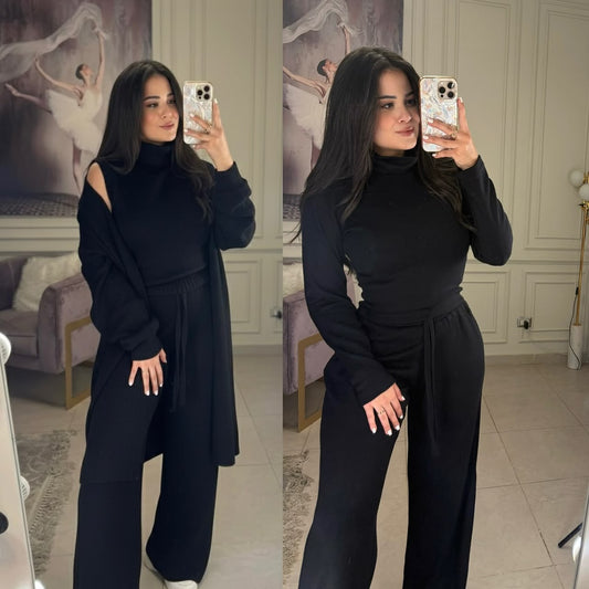 Black sleeveless jumpsuit outfit with tie waist and matching long cardigan