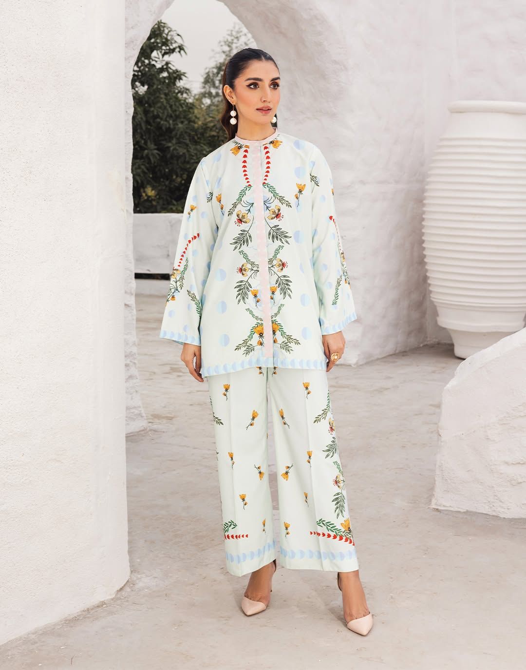 Light blue printed kurta set with matching wide-leg pants, floral embroidery at front