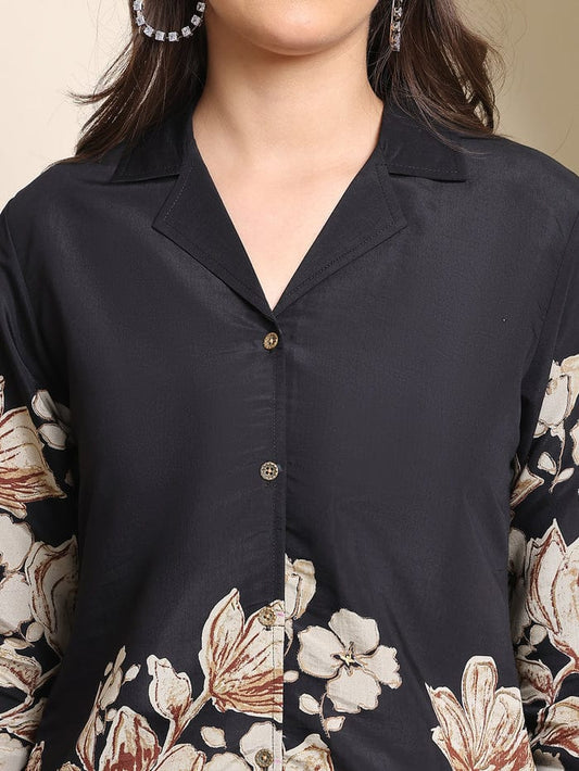 Black button-front blouse with beige and cream floral print sleeves and chest
