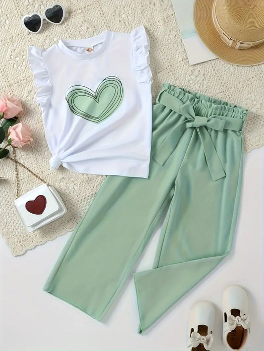White top with green heart print and mint-green pants with gathered waist bow