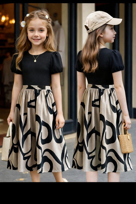 Girls black puff-sleeve dress, gathered waist, abstract cream-and-dark skirt