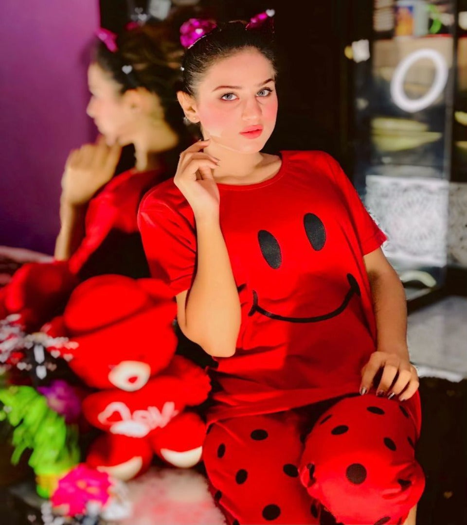 Red women's night suit set with smiley face T-shirt and printed shorts