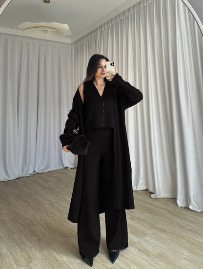 Black 3-piece co-ord: long button coat, sleeveless top, wide-leg trousers
