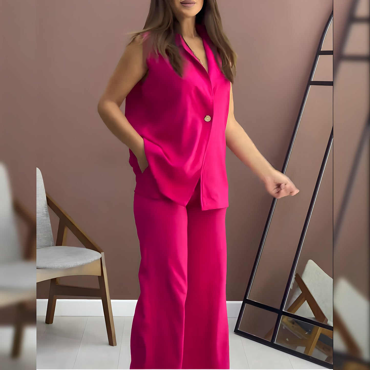 Sleeveless co-ord set with bright pink satin button-up top and matching wide-leg pants