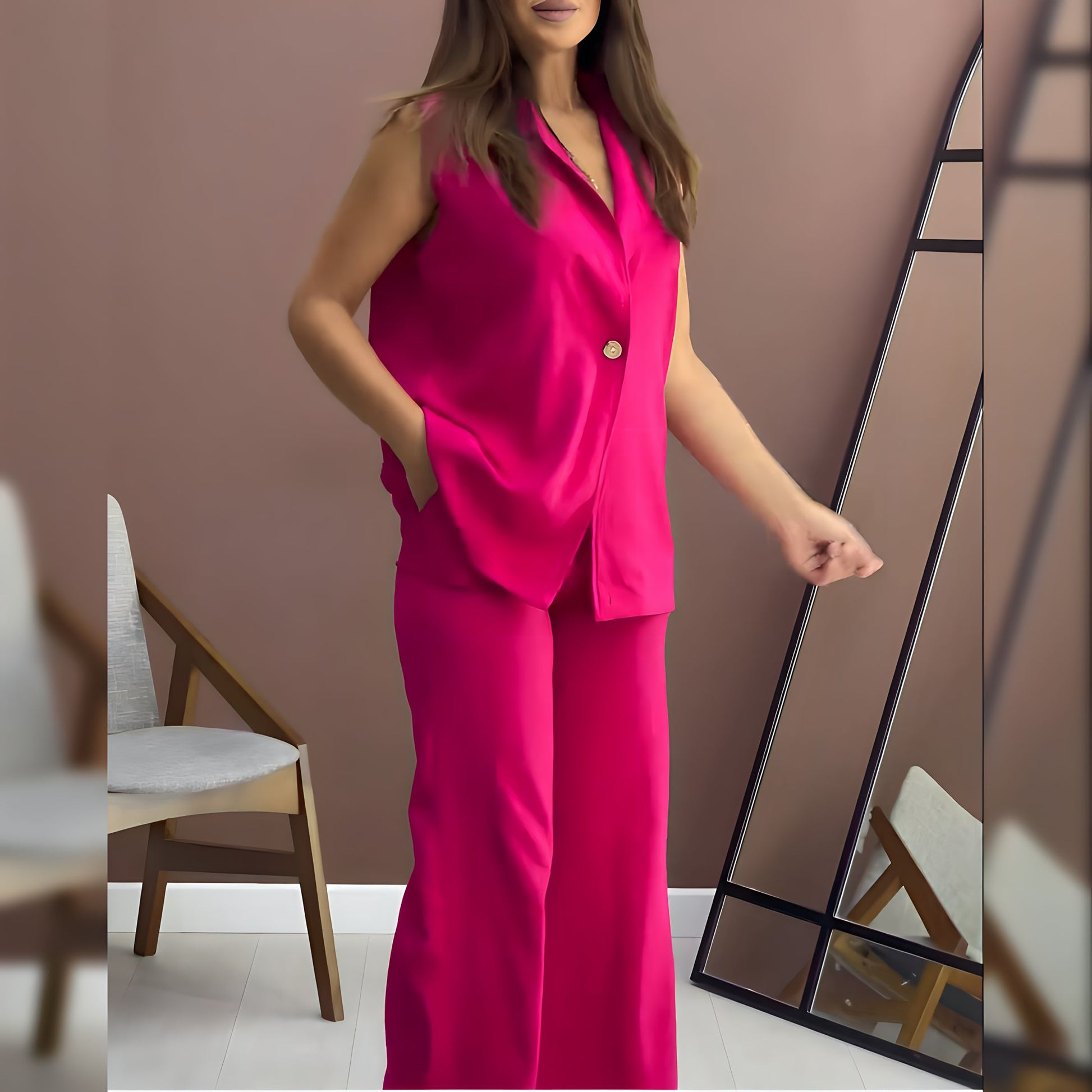 Sleeveless co-ord set with bright pink satin button-up top and matching wide-leg pants