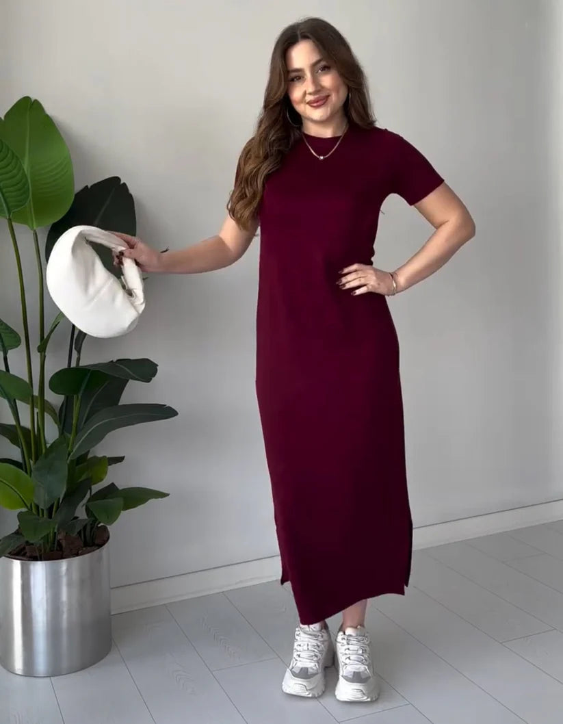 Maroon short-sleeve long top dress with round neckline, side slit, and fitted waist.