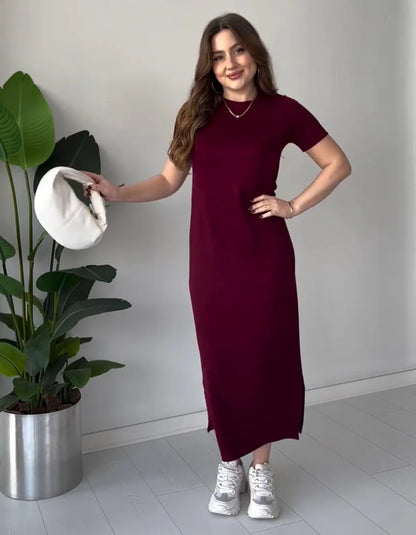 Maroon short-sleeve long top dress with round neckline, side slit, and fitted waist.
