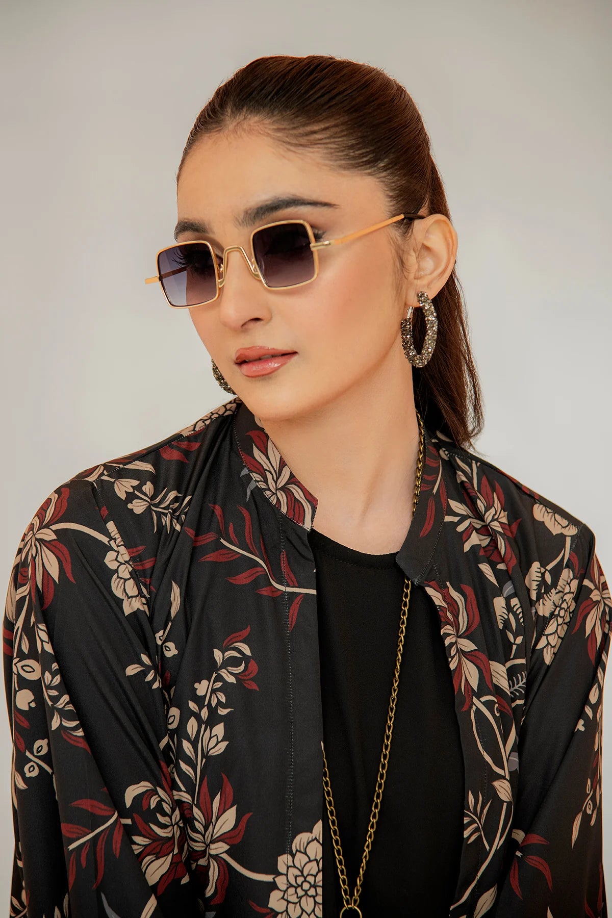 Floral black outfit set with long jacket, black top, and matching pants