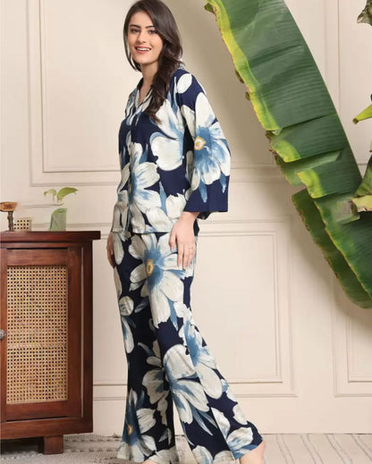 Women’s navy floral co-ord set, half-button shirt and flared pants with light blue blooms