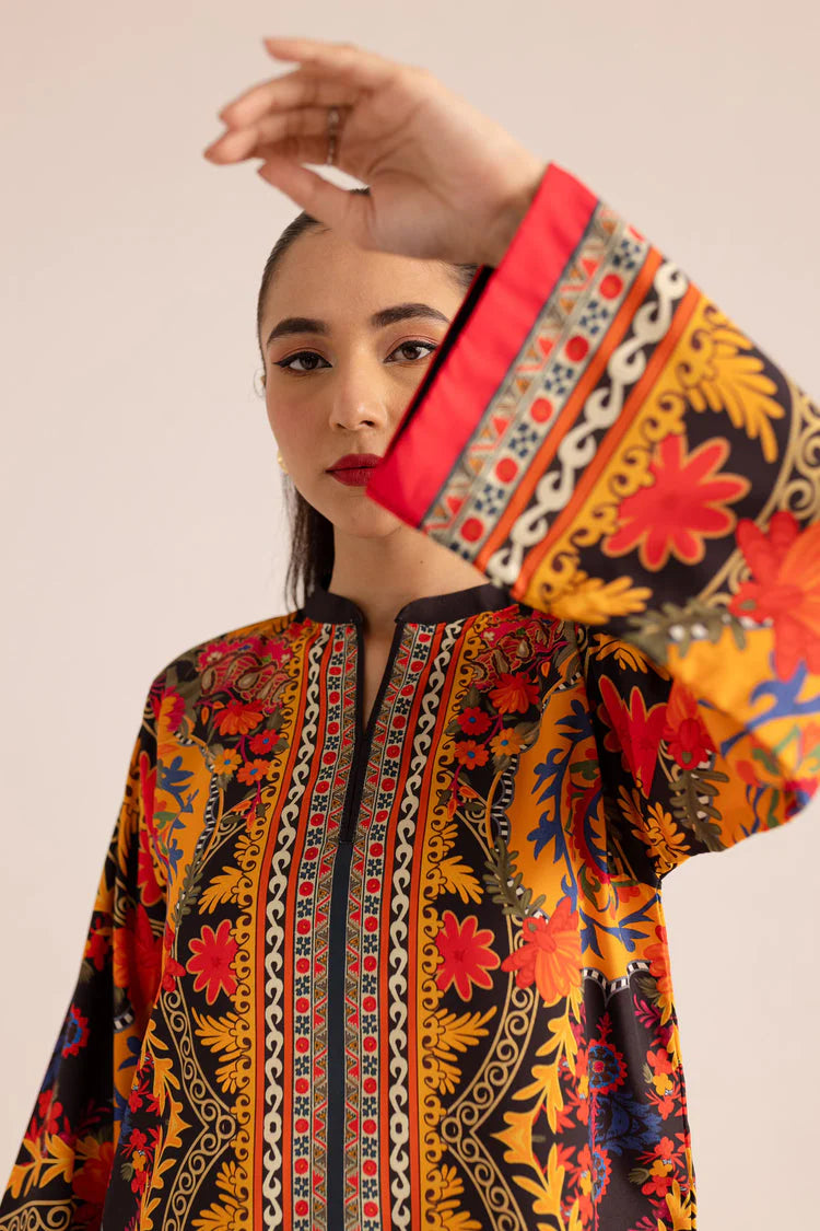 Printed tunic neckline and sleeve cuff with red trim on women's co-ord set