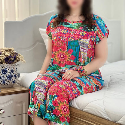 Colorful floral capri cord-set with short-sleeve top and matching capri pants, seated
