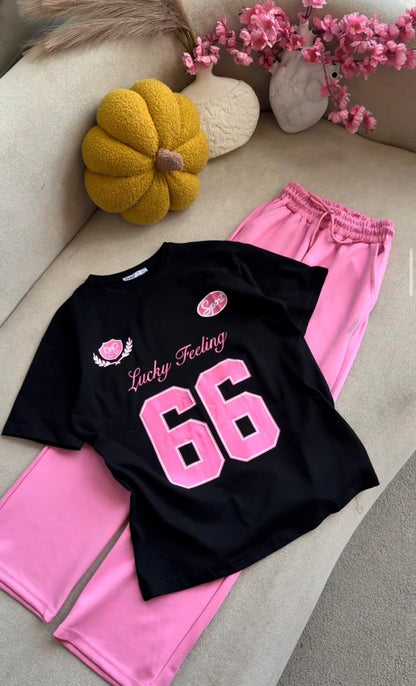 Women's oversized black T-shirt with 66 graphic and pink track pants co-ord set