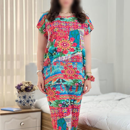 Colorful floral capri cord-set with short-sleeve top and matching capri pants, front view