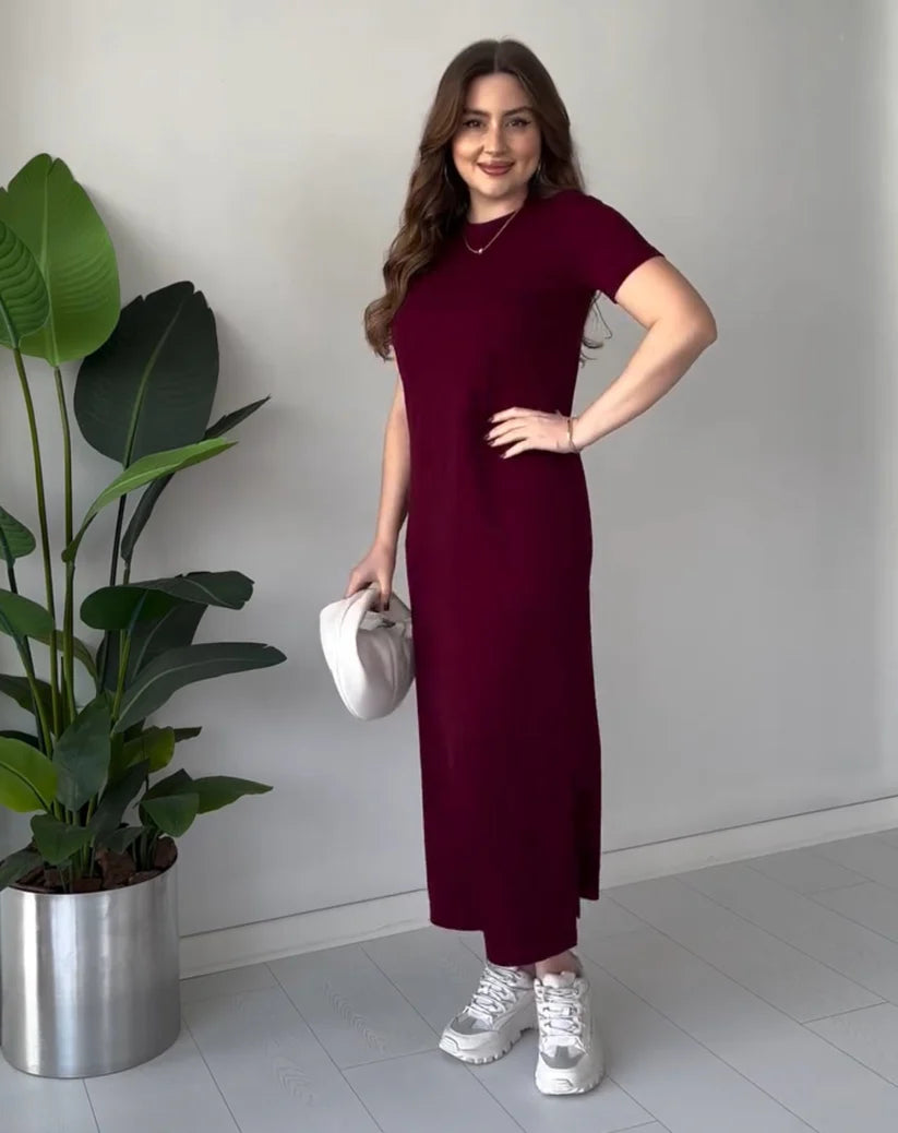 Maroon short-sleeve long top dress with round neckline, side slit, and fitted waist.