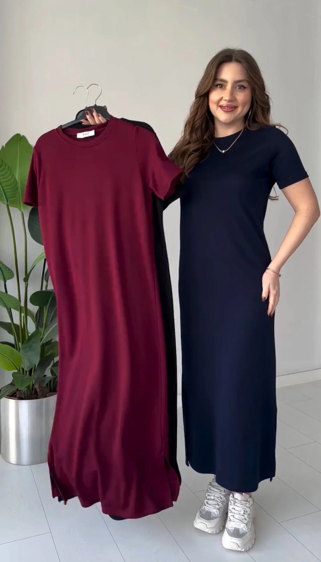 Maroon and navy short-sleeve long top dresses with round neck; navy worn on model.