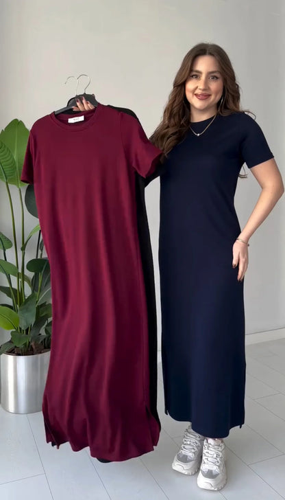Maroon and navy short-sleeve long top dresses with round neck; navy worn on model.