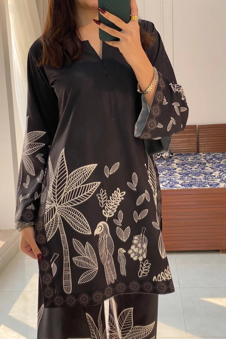 Black floral printed V-neck kurta with flared sleeves and matching wide-leg pants
