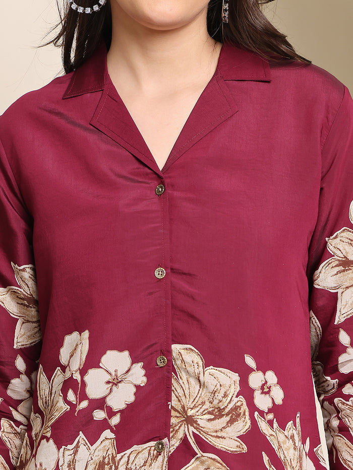 Wine-red floral kurta close-up with cream botanical print and button-front placket