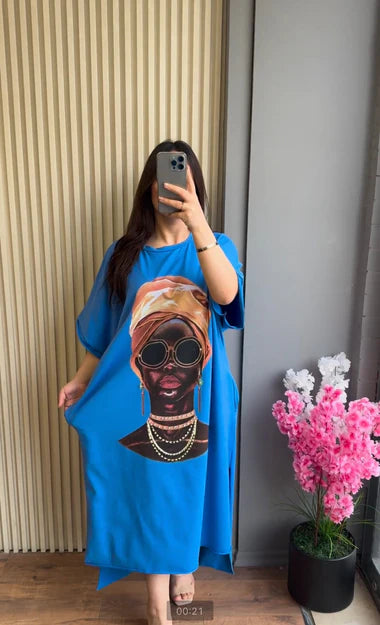 Blue drop-shoulder maxi tee with colorful skull portrait graphic, loose fit