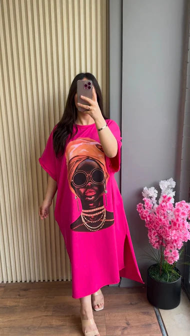 Pink drop-shoulder maxi tee with colorful skull portrait graphic, loose fit