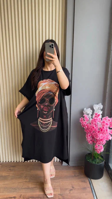 Black drop-shoulder maxi tee with colorful skull portrait graphic, loose fit