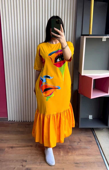 Yellow printed frill long tee dress with colorful face graphic and ruffled hem