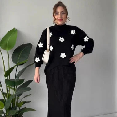 Black ribbed bodycon midi dress with long sleeves and white flower appliques