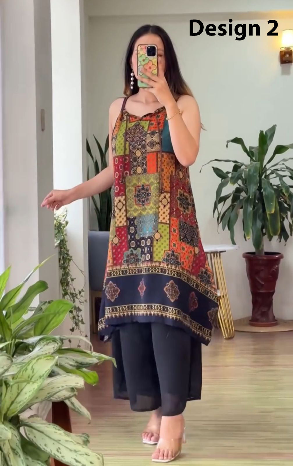 Sleeveless block-print kurti with multicolor geometric patchwork, dark base, paired palazzo