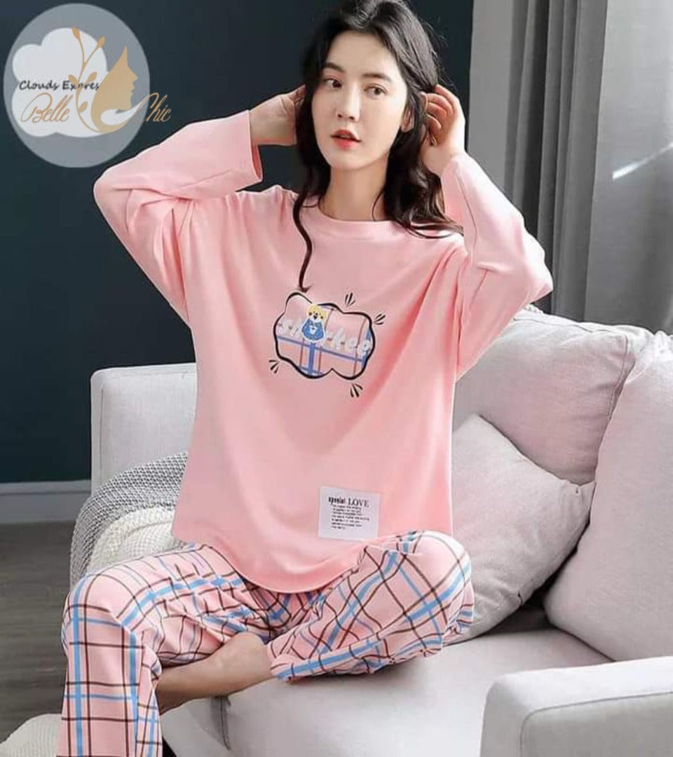 Pink printed night suit with long sleeves and cartoon shark top, plaid pajama pants