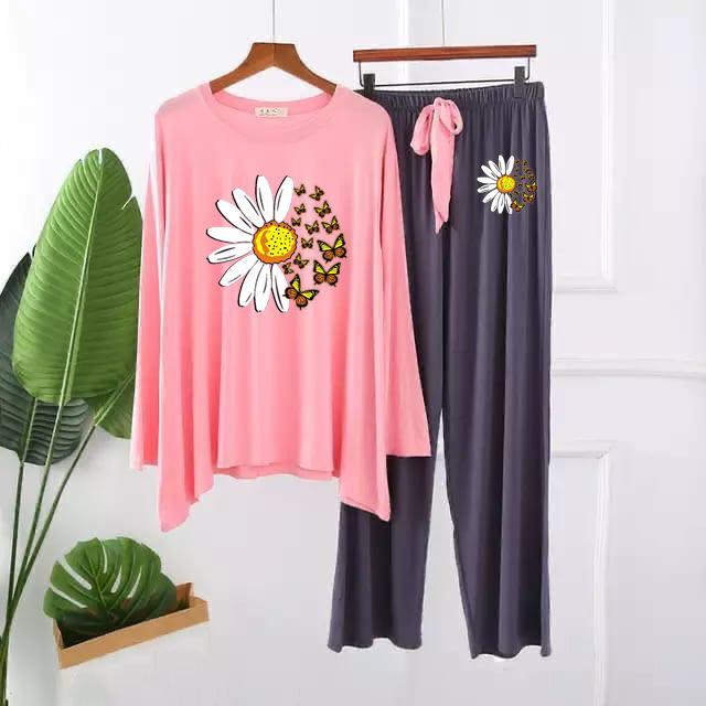 Women's loungewear set with pink long-sleeve top and navy pants, daisy and butterfly print.