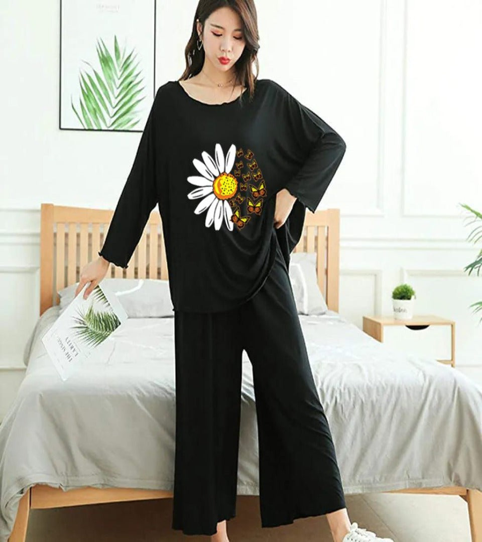 Black daisy printed lounge set: long-sleeve top with daisy graphic, wide-leg pants