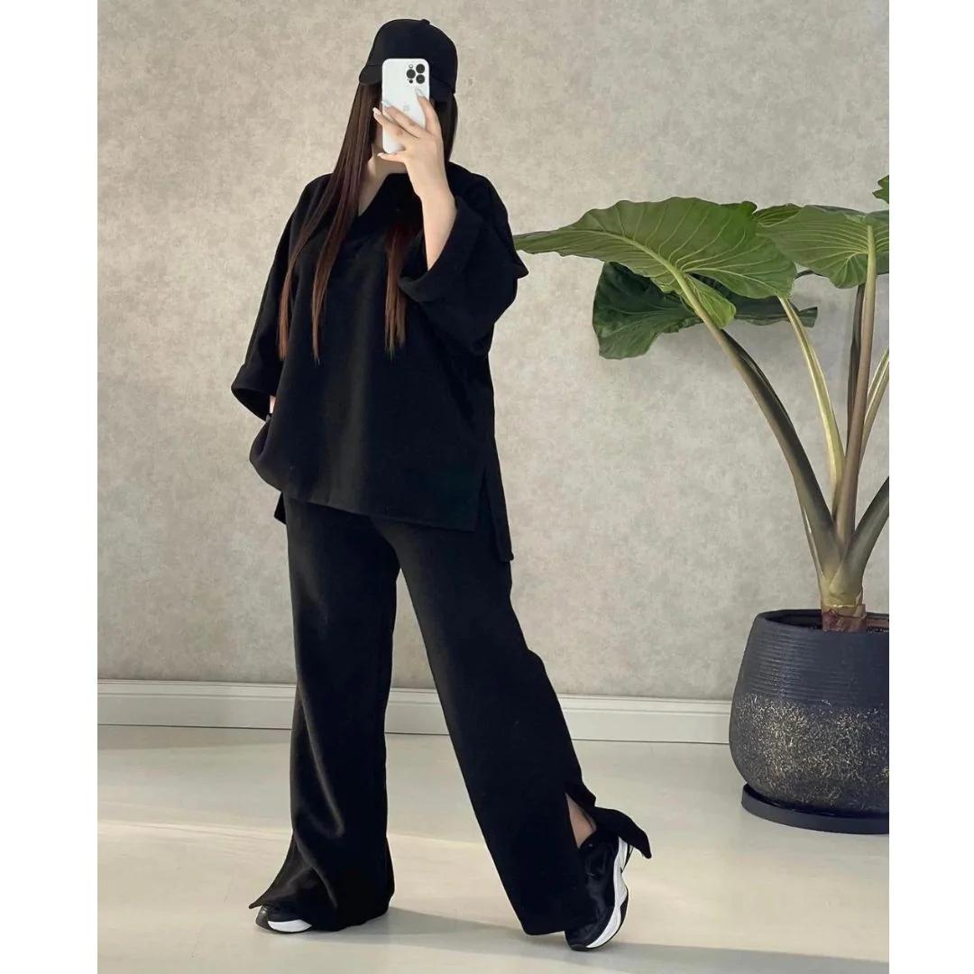 Black two-piece outfit with V-neck long-sleeve top and wide-leg pants