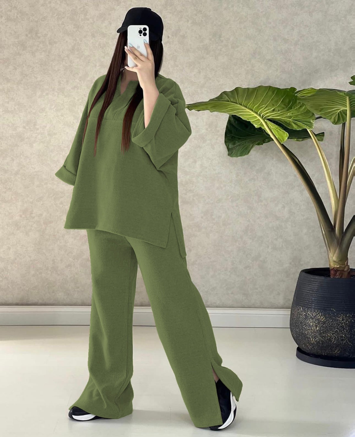 Green two-piece outfit with V-neck long-sleeve top and wide-leg pants