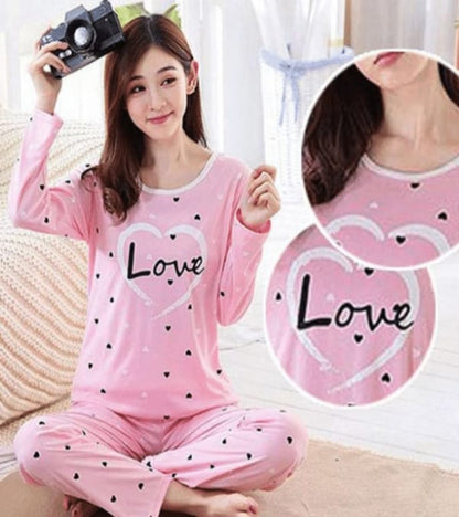 Pink women’s pajama set with long sleeves, heart “Love” print, matching pants