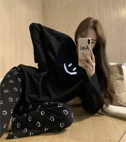 Black smiley sleepwear night dress with long sleeves, loose relaxed fit