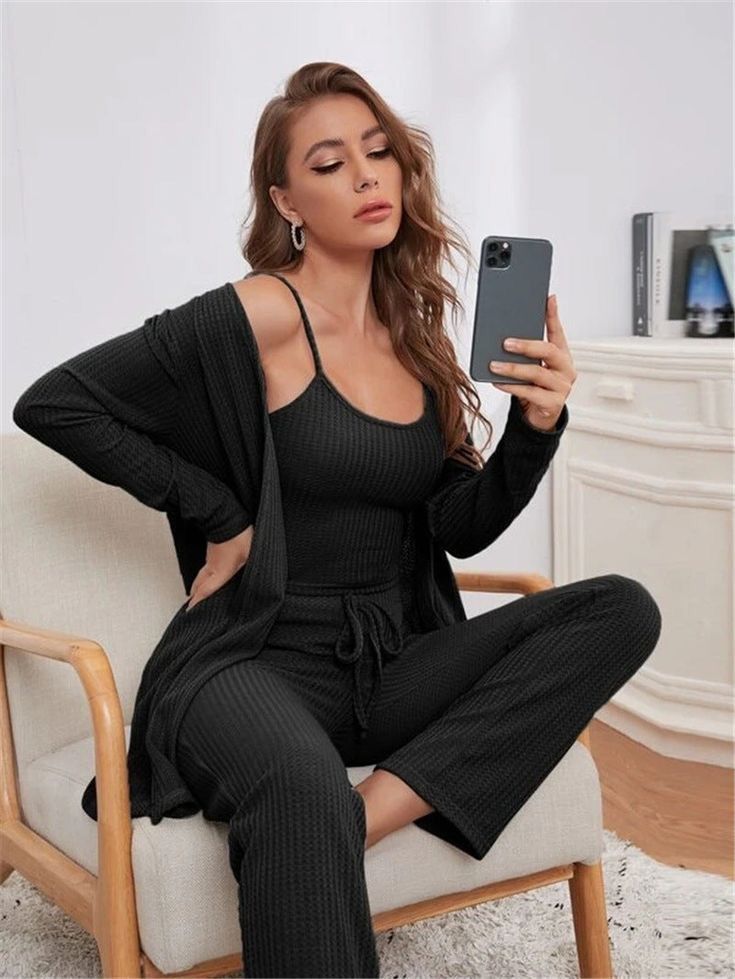 Black 3-piece lounge set: ribbed cami top, long sleeve shrug, drawstring trousers