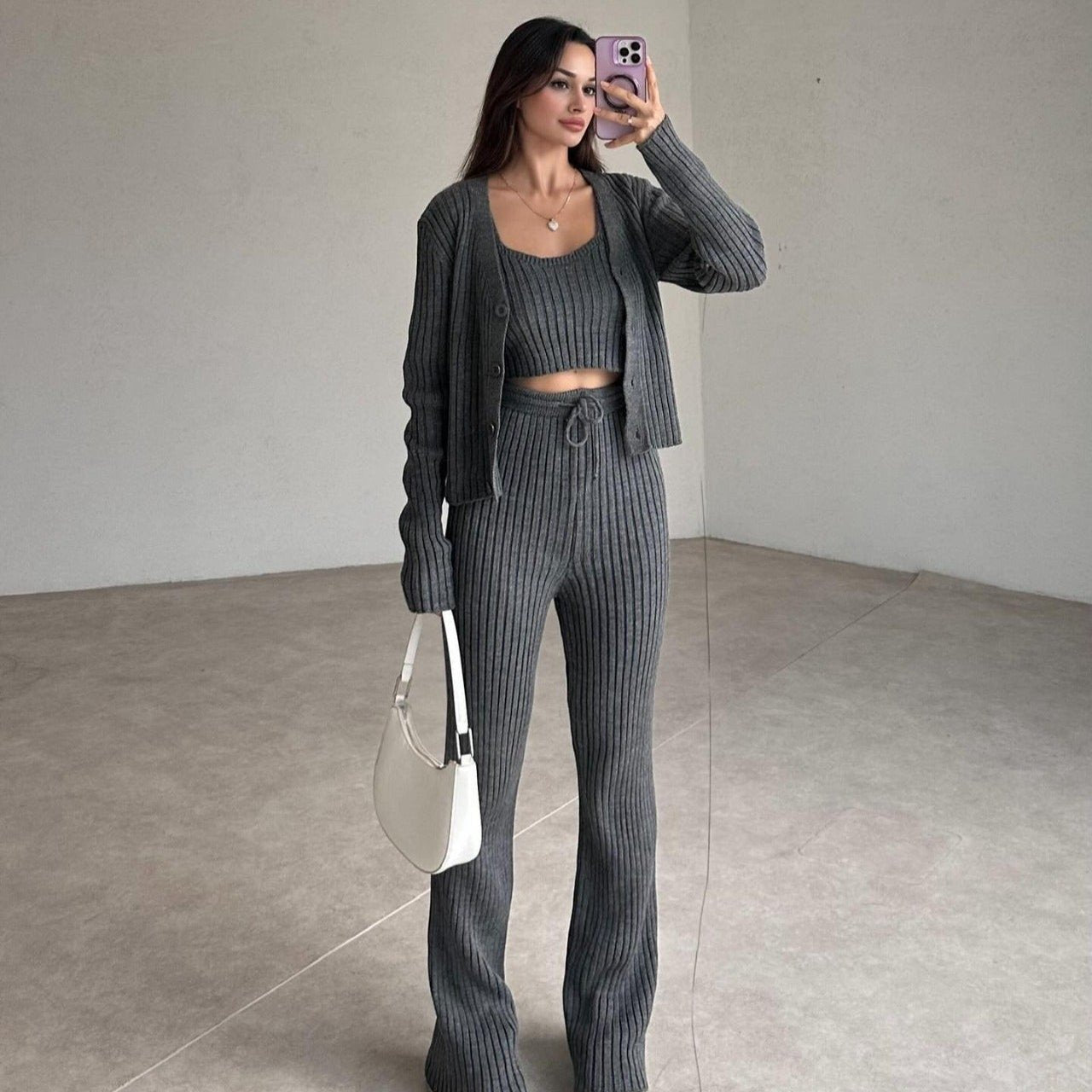 Gray ribbed knit set with cropped top, cardigan, and high-rise straight pants.
