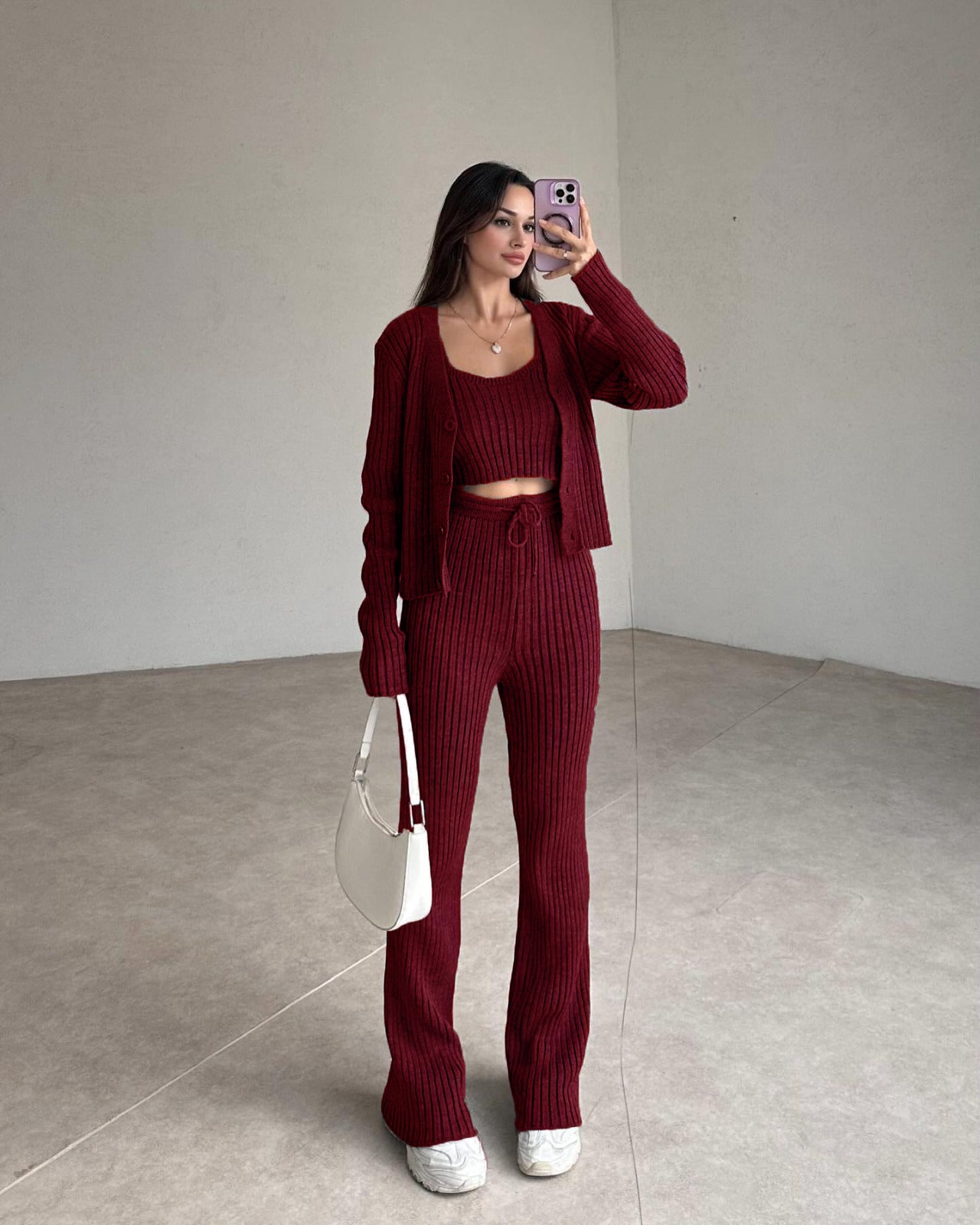 Maroon ribbed knit set with cropped top, cardigan, and high-rise straight pants.