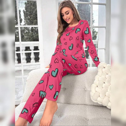 Pink heart-print long-sleeve PJ set with matching long pants, relaxed standing