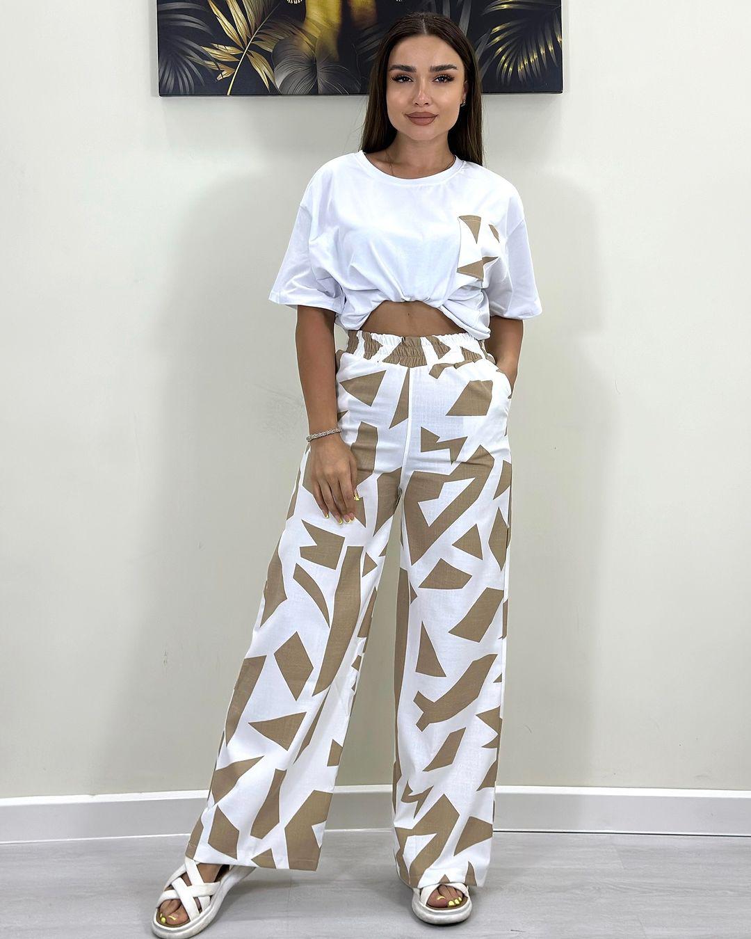 White short-sleeve T-shirt with patch pocket and beige-and-white wide-leg pants