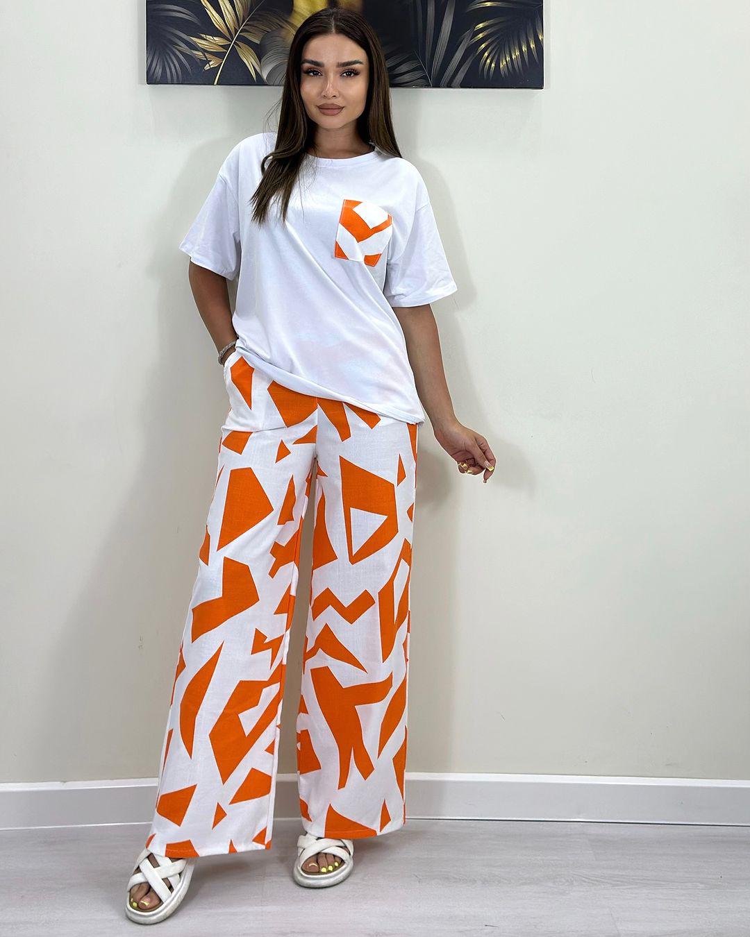 White short-sleeve T-shirt with patch pocket and orange-and-white wide-leg pants