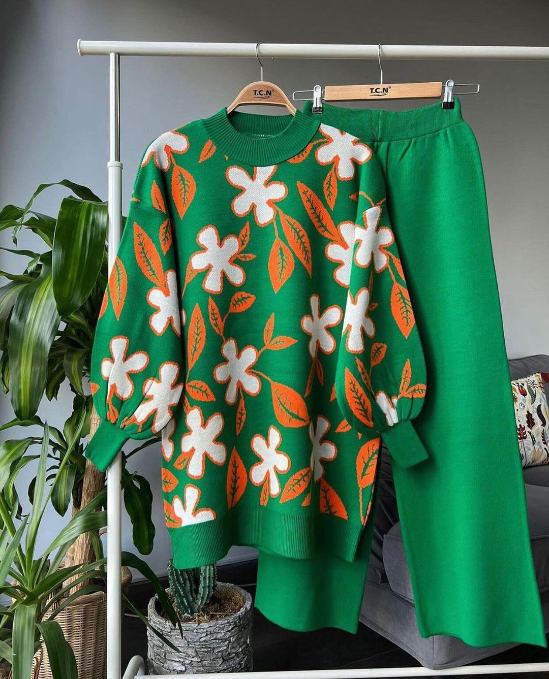 Green leaf knit sweater with white and red floral motifs and matching green trousers