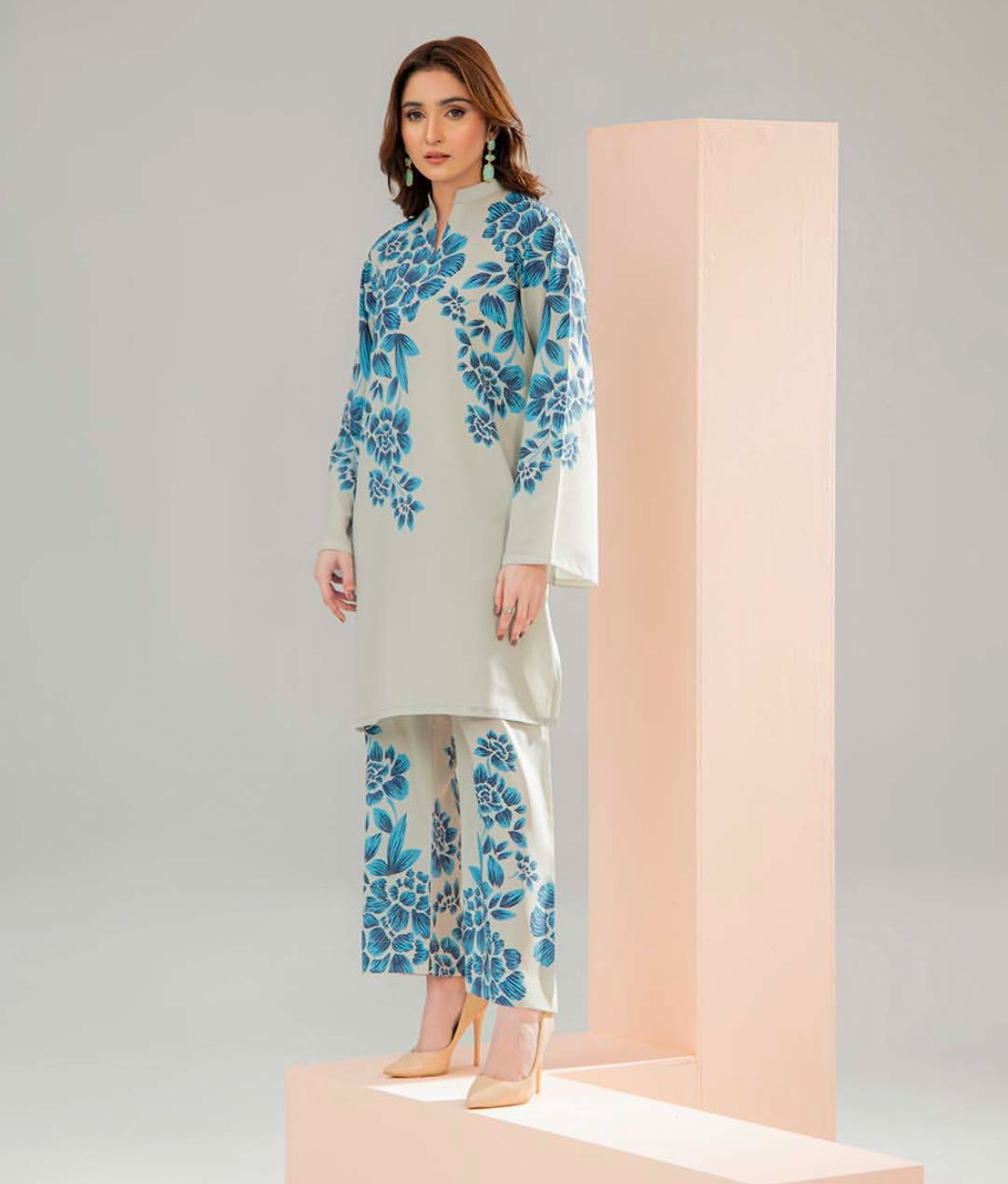 Cord set with round neck tunic and matching pants, cream base with blue floral.