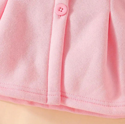 Pink hoodie front placket with two buttons and curved hem
