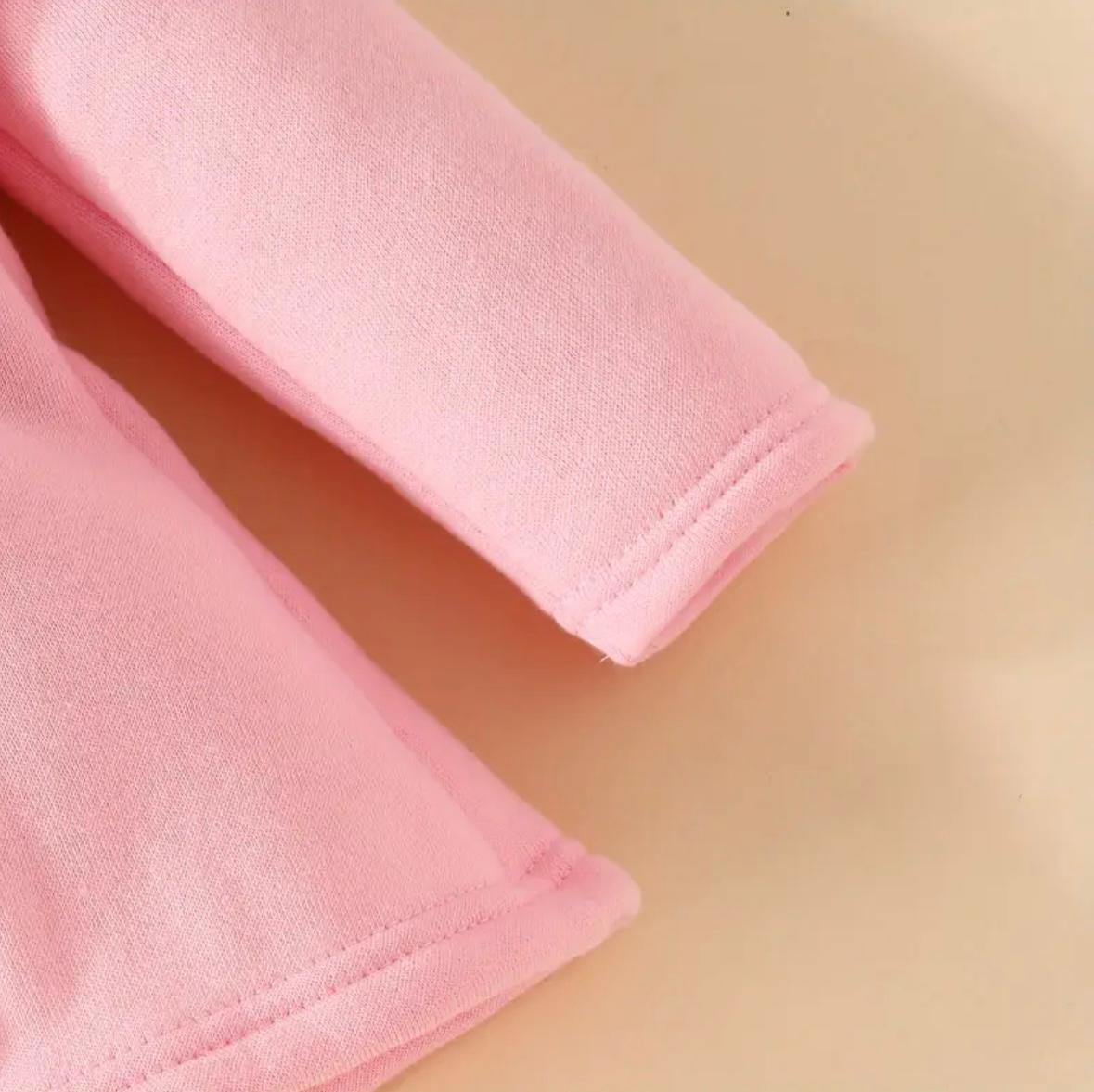 Pink hoodie sleeve with stitched cuff, soft knit finish