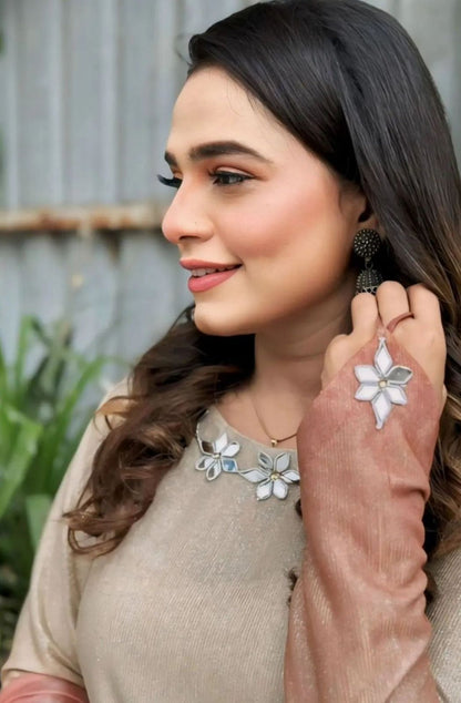 Beige embroidered long dress with pink dupatta and floral neckline detail